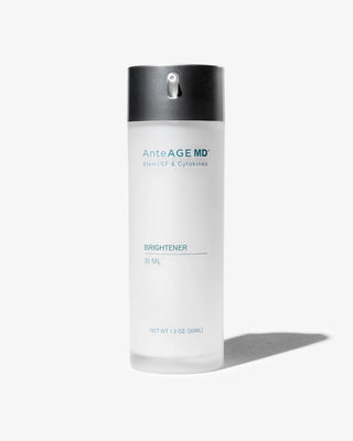 White background with a bottle of the Anteage MD Brightener sitting in the foreground. The bottle is clear-frosted with a gray dispenser. This product is used to help achieve healthier, brighter looking skin. 